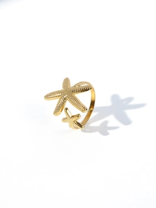 Detailed close-up of 18k gold plated starfish open ring with textured surface details