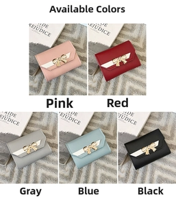 Close-up of mini wallets in five colors featuring golden bow buckles and lychee leather