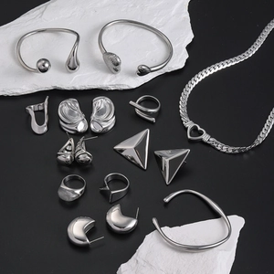 Minimalist silver stainless steel jewelry set with heart necklace, bangles and rings