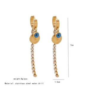 Detail of long tassel earrings with evil eye bead and rhinestones showing 7cm height