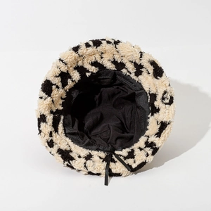 Thick black and white houndstooth plush bucket hat with adjustable inner drawstring