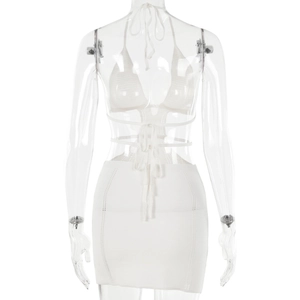 Detail view of the back of a white crochet knit two-piece set with halter back ties