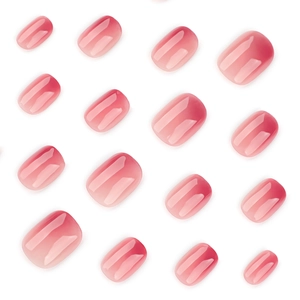 Mini short round press on nails with pink blush gradient and high gloss jelly finish