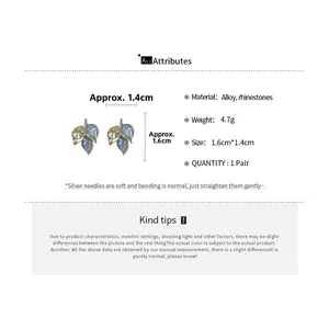 Detailed view of enamel leaf earrings with dimensions and rhinestone inlay details