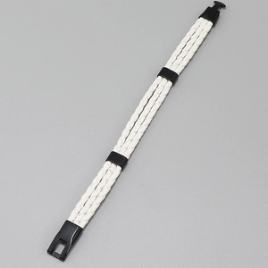 Detail shot of a white multi-layer braided leather bracelet with black magnetic clasp