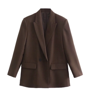 Detailed close-up of a brown mid-length blazer with notch lapels and single button closure