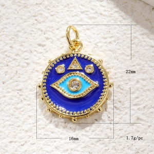 Detail showing dimensions of 22x16mm gold evil eye charm with blue enamel inlay