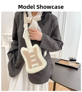 Detail of guitar-shaped crossbody bag featuring star studs and chic color blocking
