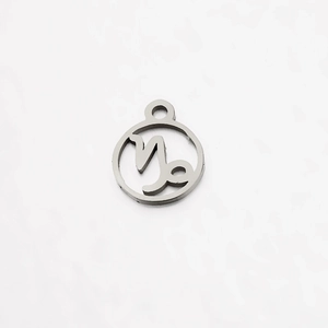 Detailed macro view of a silver stainless steel Capricorn zodiac charm for jewelry making