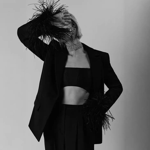 Slim fit black blazer set with ostrich feather cuffs and rhinestone accessories