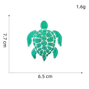 Detailed embroidery patch of a green sea turtle measuring 7.7cm by 6.5cm on white background