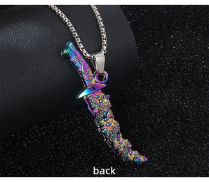 Detailed back view of a rainbow iridescent dagger pendant with embossed dragon texture
