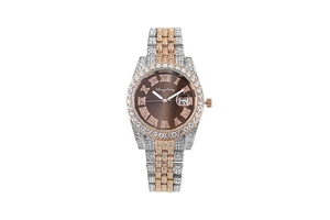Detail of two-tone crystal watch with Roman numerals and date display on brown dial