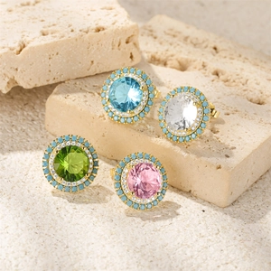 Detailed close-up of four colors of S925 silver round turquoise and zircon stud earrings