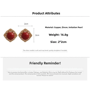 Detail view of square pearl earrings with red center stone and gold frame dimensions
