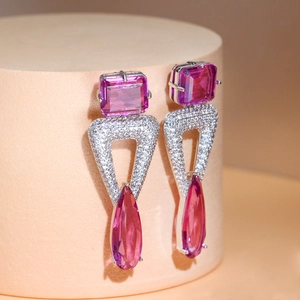 Elegant S925 geometric triangle earrings with pink zircon on a beige pedestal stand