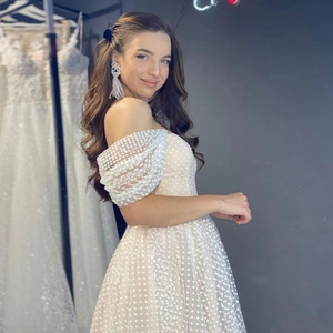 Polka dot sequin wedding dress with off-shoulder design and sheer pleated sleeves