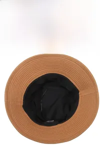 Detail view of the brown bucket hat's black fabric lining and durable inner stitching