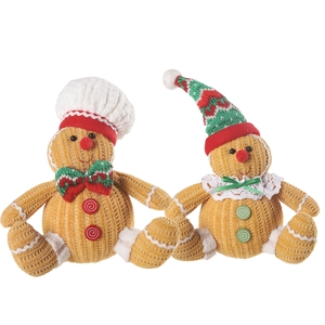Gebreid peperkoekpaar met koksmuts en kerstmuts voor feestelijke kerstversieringen