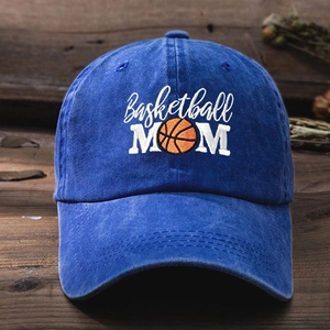 Navy blue washed cotton baseball cap with white Basketball MOM embroidery on wood surface
