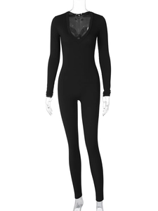 Close-up of black ribbed knit fabric detail on deep V-neck long sleeve jumpsuit