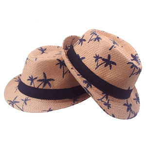 Light brown straw fedora hats with blue palm tree patterns for summer beach vacations