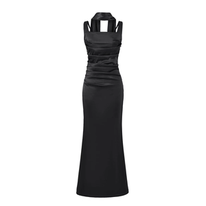 Detail of elegant black satin evening dress with pleated texture and halter neck design