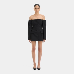 Detail of off-shoulder black blazer dress with double-breasted buttons and long sleeves