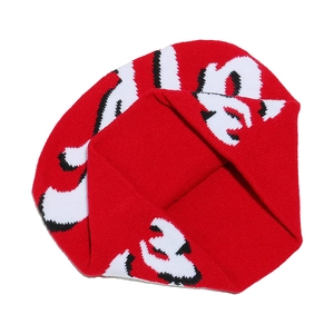Detailed close-up of red knit beanie featuring black and white jacquard letter patterns