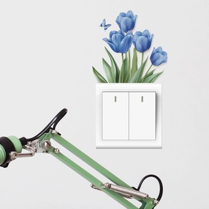 Blue tulip wall sticker with butterfly detail placed above a white light switch decor