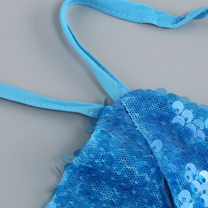 Close-up of blue sequins and mesh fabric on a stylish backless slit dress