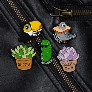 Detailed close-up of cartoon enamel pins with puns pinned on a black leather jacket