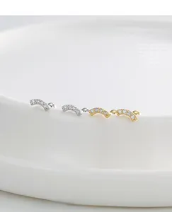 Detailed macro view of S925 silver curved stud earrings with micro-set zircon and screw backs
