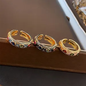 Baroque style gold open rings with colorful zircons in black, blue and white coating