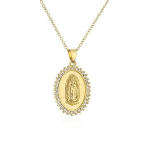 Close-up of gold Virgin Mary pendant with sparkling white cubic zirconia bezel
