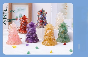 Detailed macro view of colorful natural crystal gravel Christmas tree with gold leaf foil