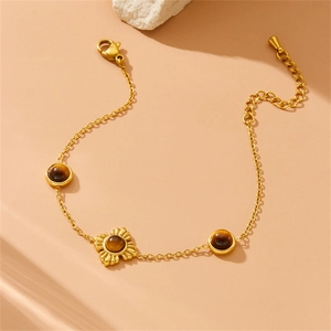 Elegant gold-plated stainless steel bracelet with flower pendant and tiger eye stones