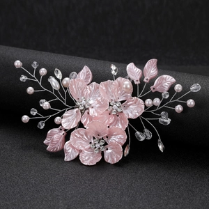 Elegant bridal hair clip with pink flowers, white pearls and sparkling crystals
