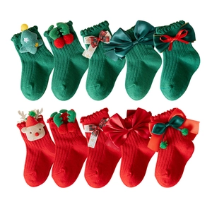Red and green Christmas cotton socks for baby girls featuring cute reindeer and tree patterns