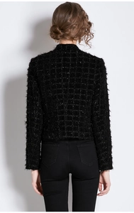 Back view of a slim black tweed jacket featuring shimmering metallic yarn and fringe details
