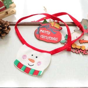 Detail of a handmade snowman pet Christmas bib with red tie and festive embroidery