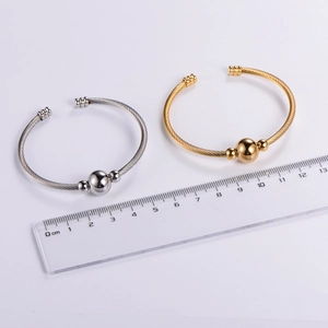 Adjustable twisted cable wire bracelets in gold and silver finish with ball accents