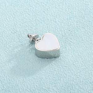 Detail of silver heart locket pendant with white mother-of-pearl inlay and screw-top cap