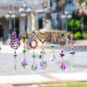 Detail of seven crystal suncatchers featuring animal and floral rhinestone designs