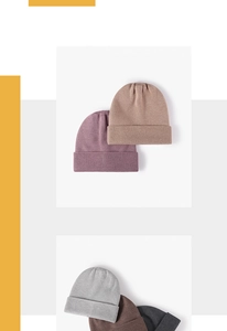 Detail of knitted winter beanies showing soft textures in pink, beige, and grey colors