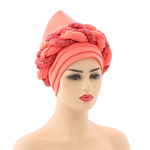 Close-up of coral sequined braided detail on a stylish fashion turban hat for women