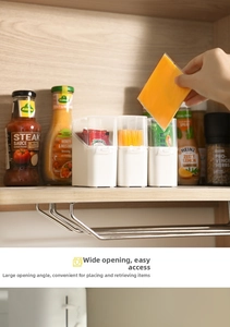 Detailed view of kitchen storage box with large opening for easy access to tea bags