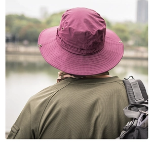 Outdoor quick-dry sun hat with breathable vents and adjustable brim in a hiking scene