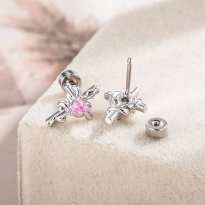Cross and bow earrings with pink heart zircon and secure screw-back design