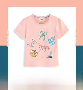 Close-up of pink cotton kids T-shirt featuring colorful horse and butterfly prints